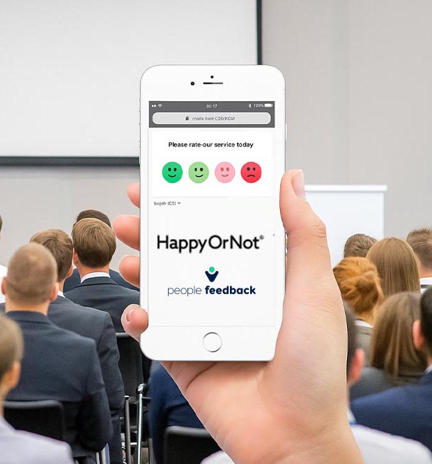 Pantalla de smartphone mostrando una encuesta digital de Smiley Digital con caritas de satisfacción integradas en una web móvil